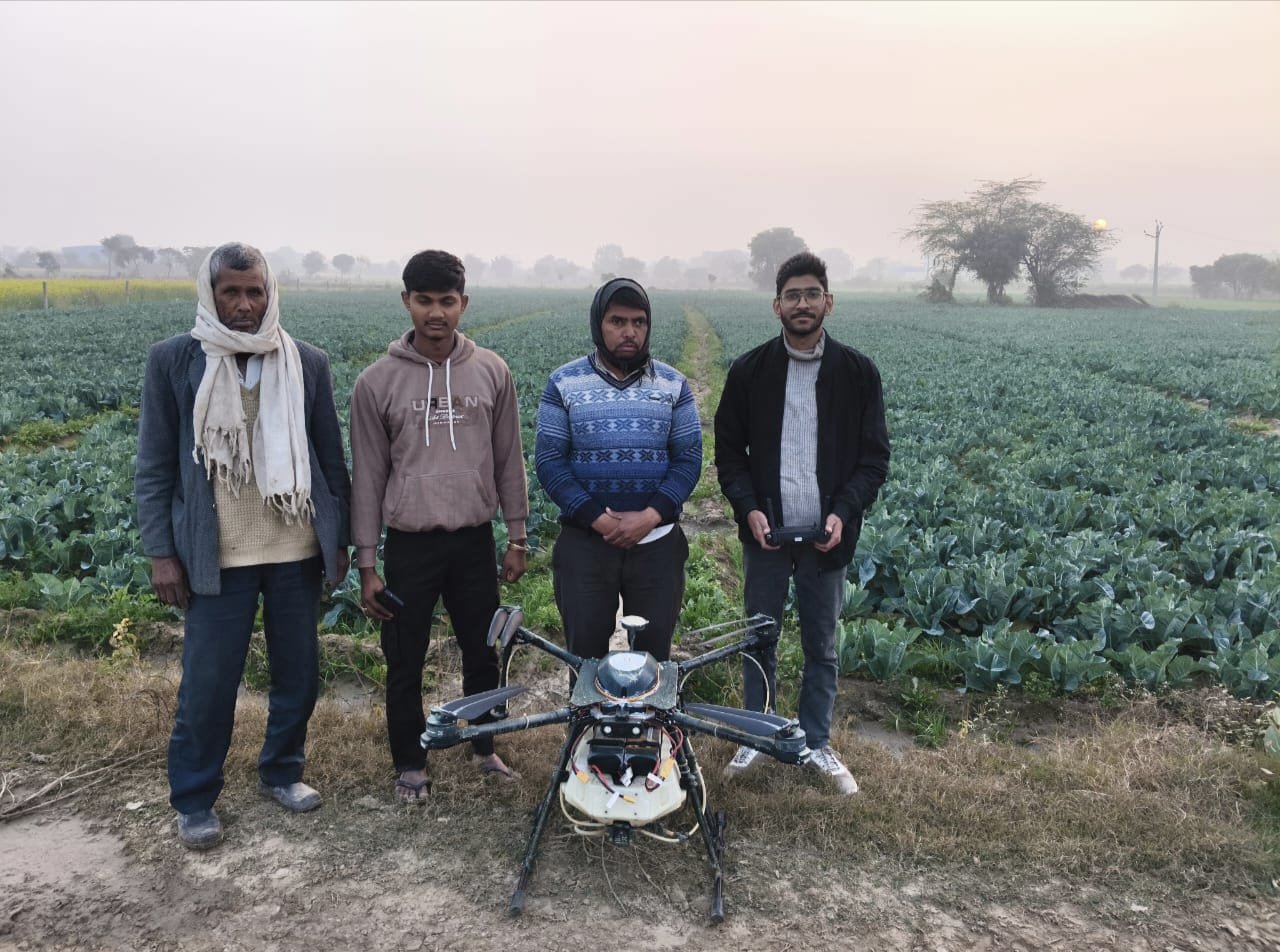 Farmers and field team with AgriFly S10 during agriculture spraying operations