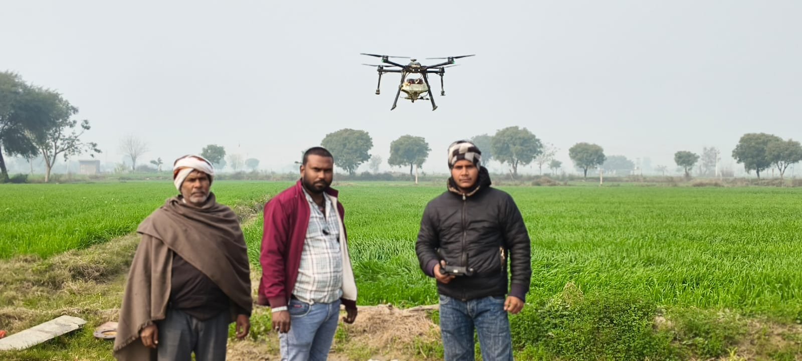 Agriculture drone operating over a field during Aerocarrier spraying service
