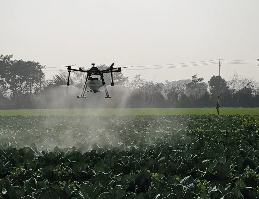 AgriFly S10 spraying crops during agriculture field operations